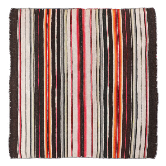 Intiearth vintage Peruvian Frazada textile with colorful geometric patterns and stripes. Traditional handwoven multipurpose textile from Peru, ideal for home décor, can be used as a blanket, rug, throw, or wall hanging. Made of handspun wool and crafted on a backstrap loom.