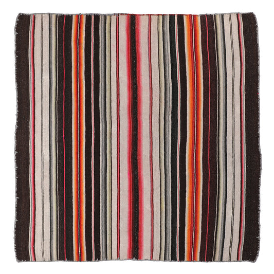 Intiearth vintage Peruvian Frazada textile with colorful geometric patterns and stripes. Traditional handwoven multipurpose textile from Peru, ideal for home décor, can be used as a blanket, rug, throw, or wall hanging. Made of handspun wool and crafted on a backstrap loom.