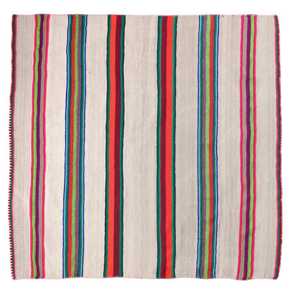 Intiearth vintage Peruvian Frazada textile with colorful geometric patterns and stripes. Traditional handwoven multipurpose textile from Peru, ideal for home décor, can be used as a blanket, rug, throw, or wall hanging. Made of handspun wool and crafted on a backstrap loom.