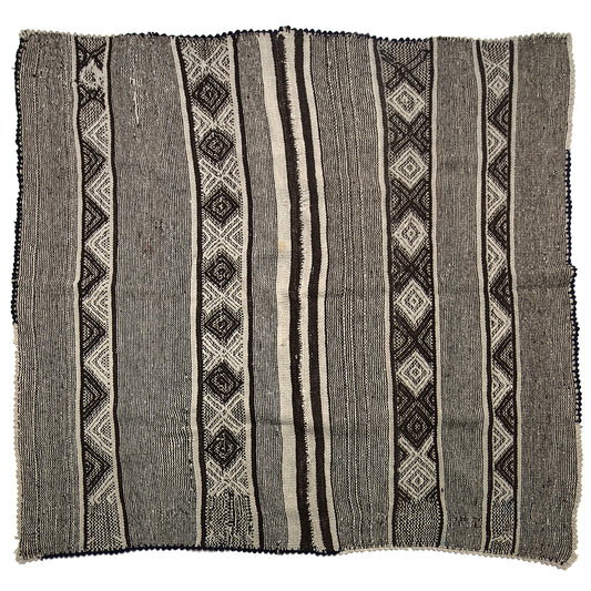 Vintage Peruvian Frazada textile with colorful geometric patterns and stripes. Traditional handwoven multipurpose textile from Peru, ideal for home décor, blankets, or throws, or rug.