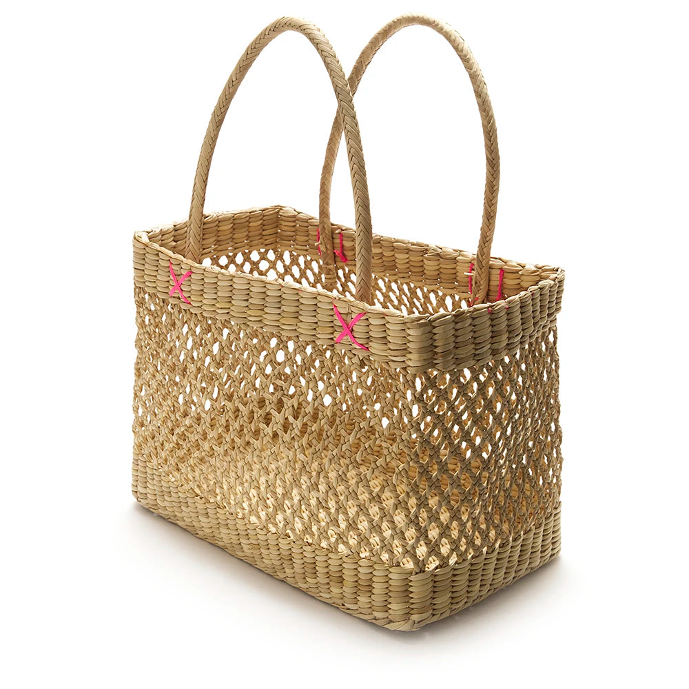 Woven basket with handles on a white background