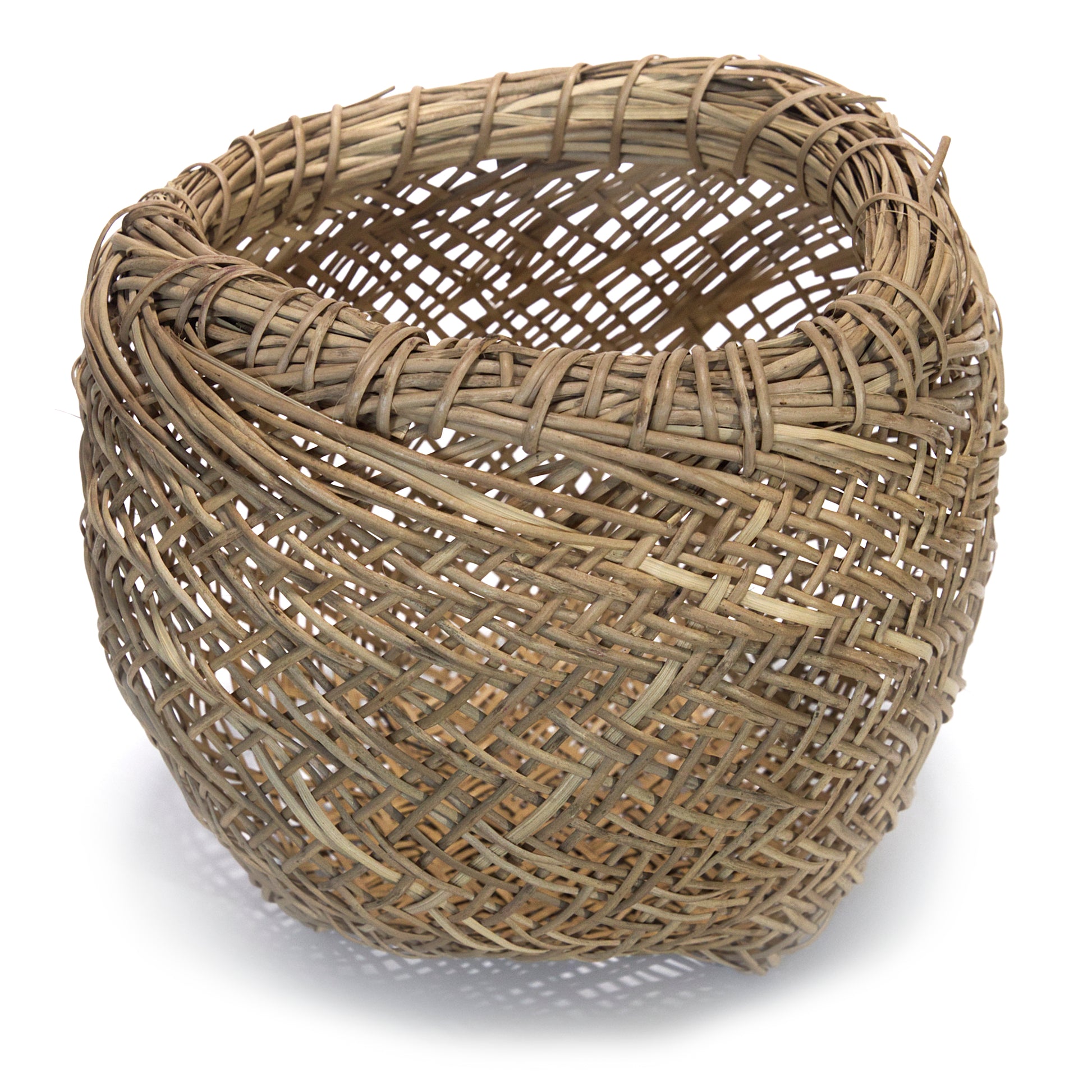 Woven wicker basket on a white background