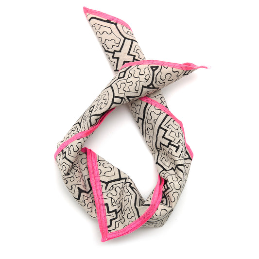 Handcrafted Shipibo bandana made from traditional fabric, featuring intricate geometric kené designs painted with natural pigments. Each piece is one-of-a-kind, reflecting the spiritual intention and energy of the artist. The vibrant patterns represent sacred Ikaros healing songs, offering protection, connection, and transformation, deeply rooted in Shipibo-Conibo culture and tradition