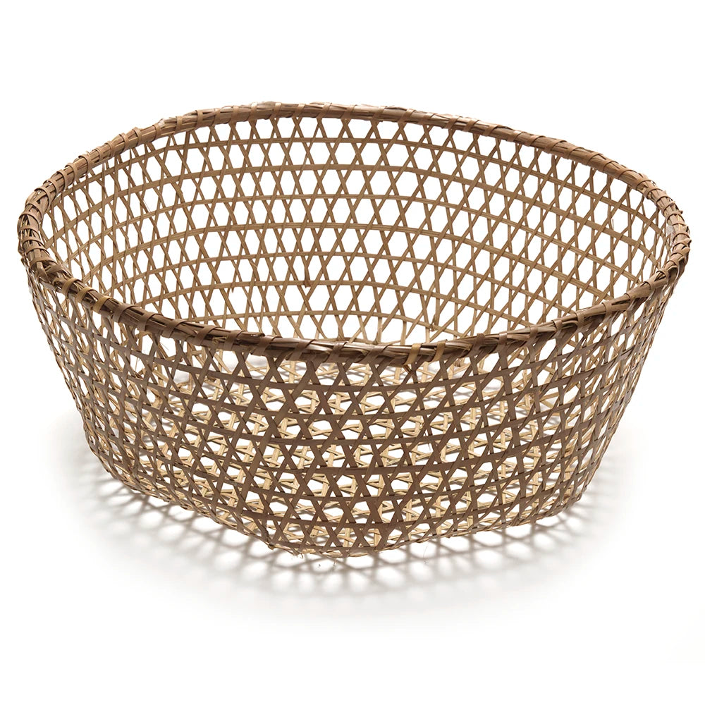 Woven basket with a geometric pattern on a white background