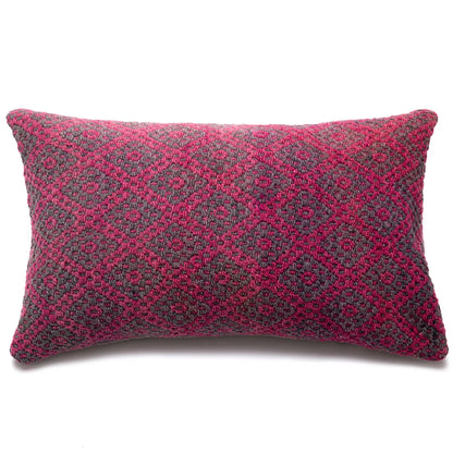 Decorative pillow with pink and gray pattern on a white background