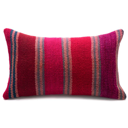 A rectangular woven throw pillow with vertical stripes in vibrant magenta, deep red, and dusty pink, set against a plain white background.