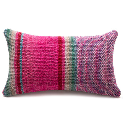 A rectangular woven lumbar pillow featuring a vibrant multicolor striped pattern with prominent pink, teal, red, and beige vertical bands, set against a plain white background.