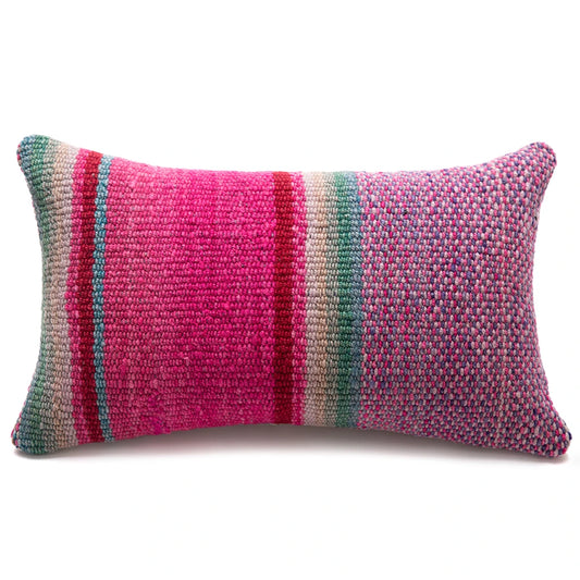 A rectangular woven lumbar pillow featuring a vibrant multicolor striped pattern with prominent pink, teal, red, and beige vertical bands, set against a plain white background.