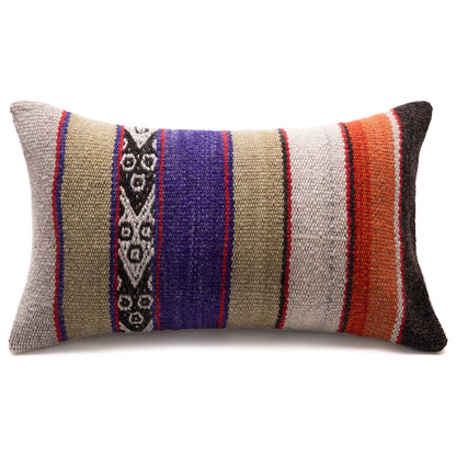 Colorful striped pillow with geometric patterns on a white background
