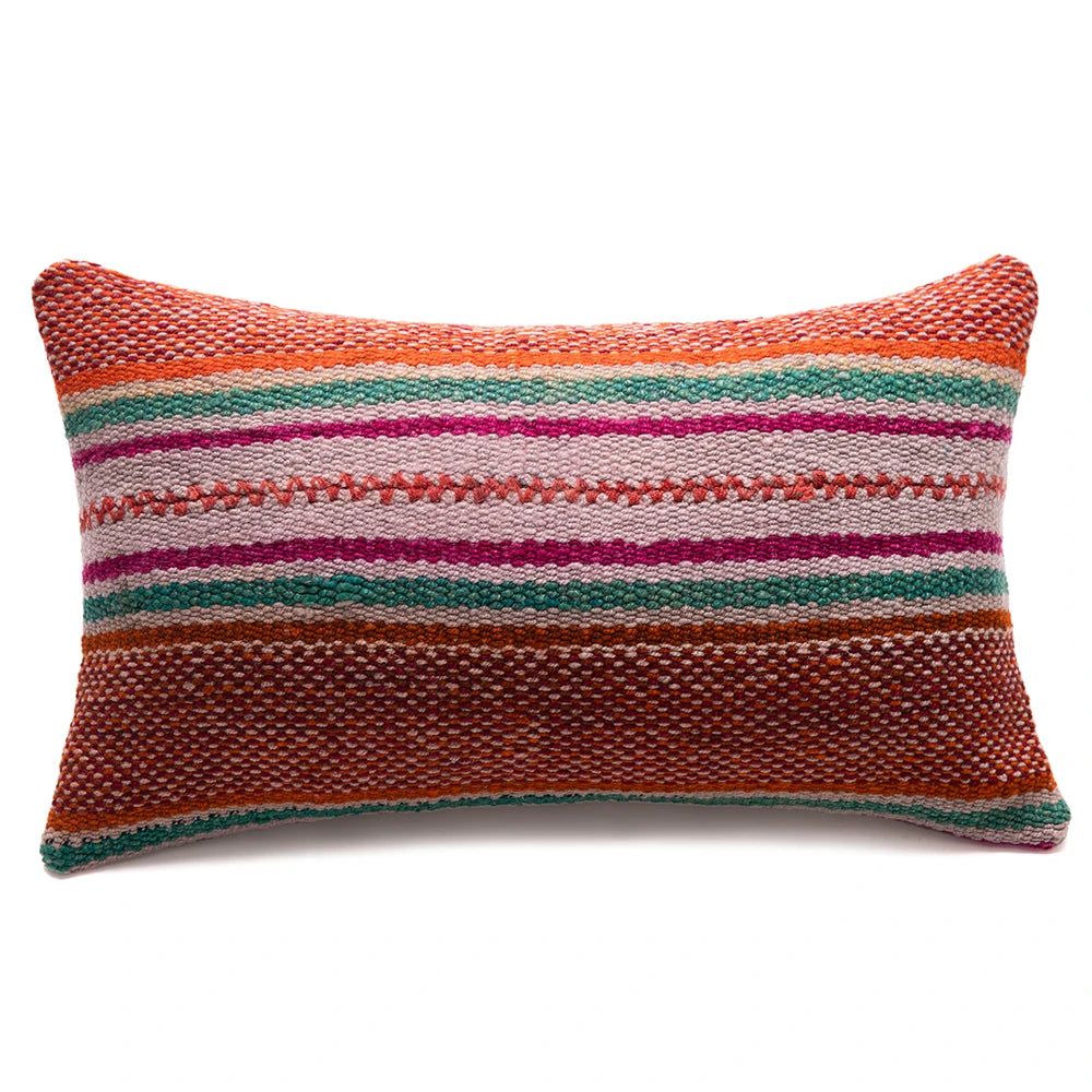 Multicolored striped pillow on a white background