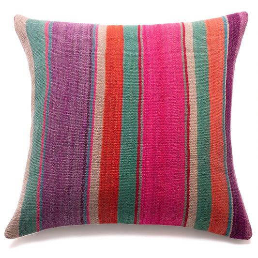 A square throw pillow with a textured, woven fabric featuring vertical stripes in purple, teal green, orange, pink, and beige, set against a plain white background.