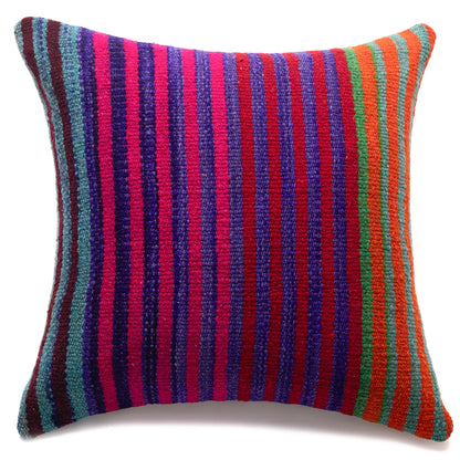 A square woven throw pillow featuring vibrant vertical stripes in magenta pink, purple, red, orange, green, and teal on a white background.