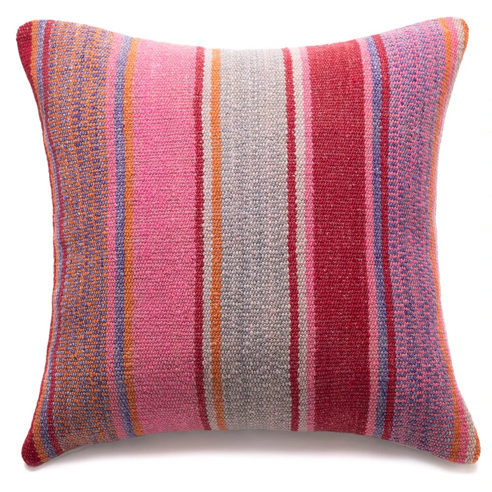 Striped pillow with pink, red, and orange colors on a white background