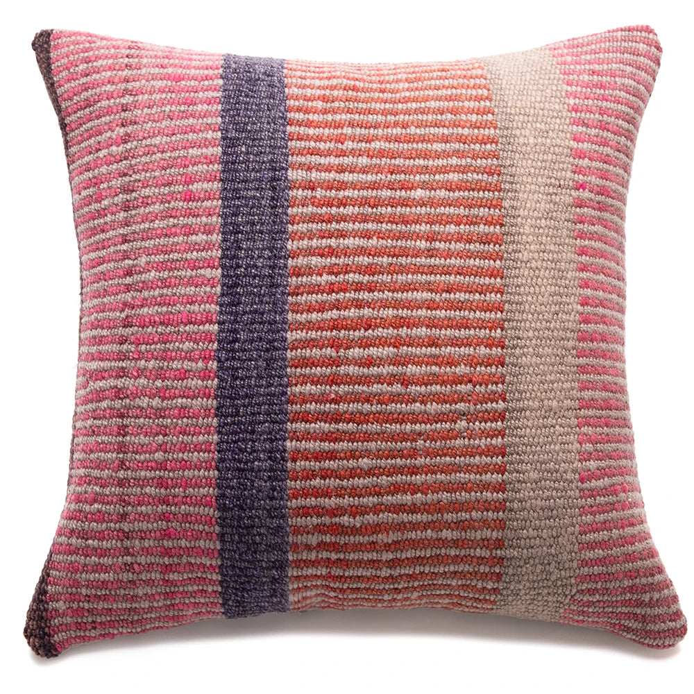 Textured pillow with pink, purple, and orange stripes on a white background