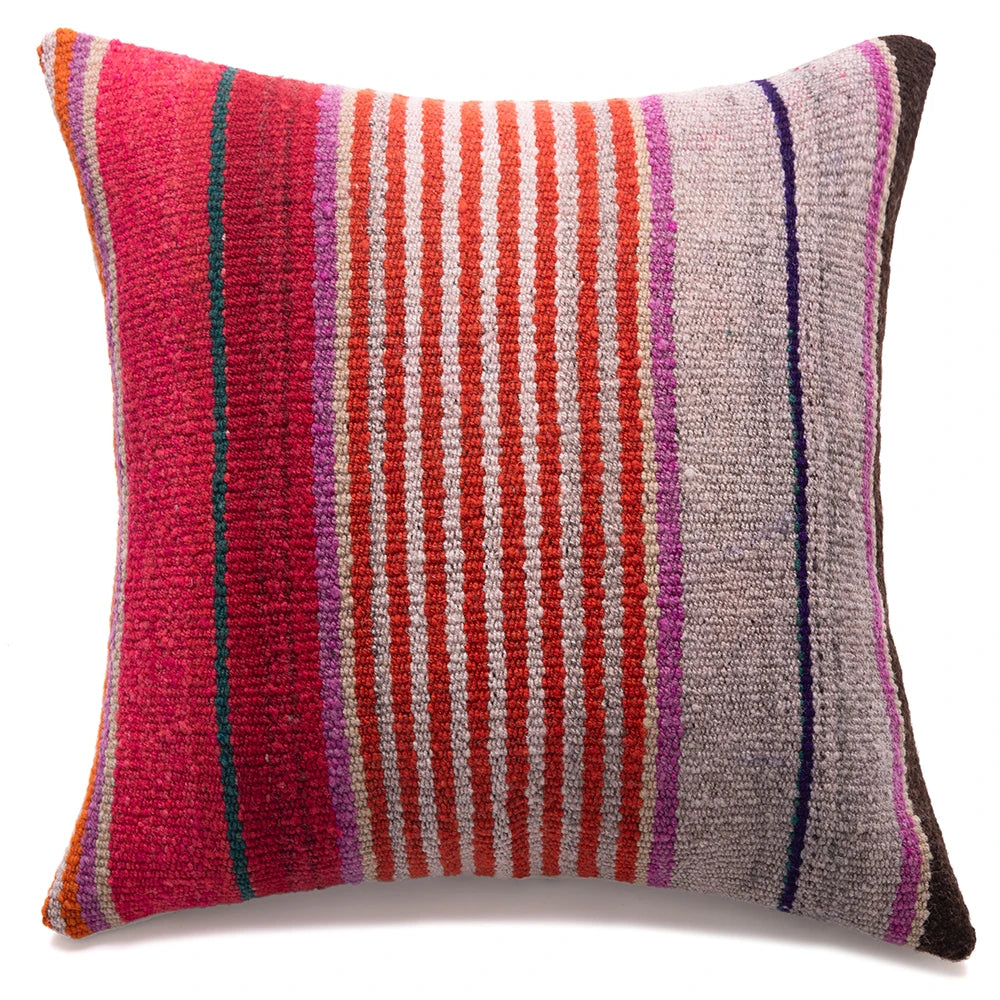 Multicolored striped pillow on a white background