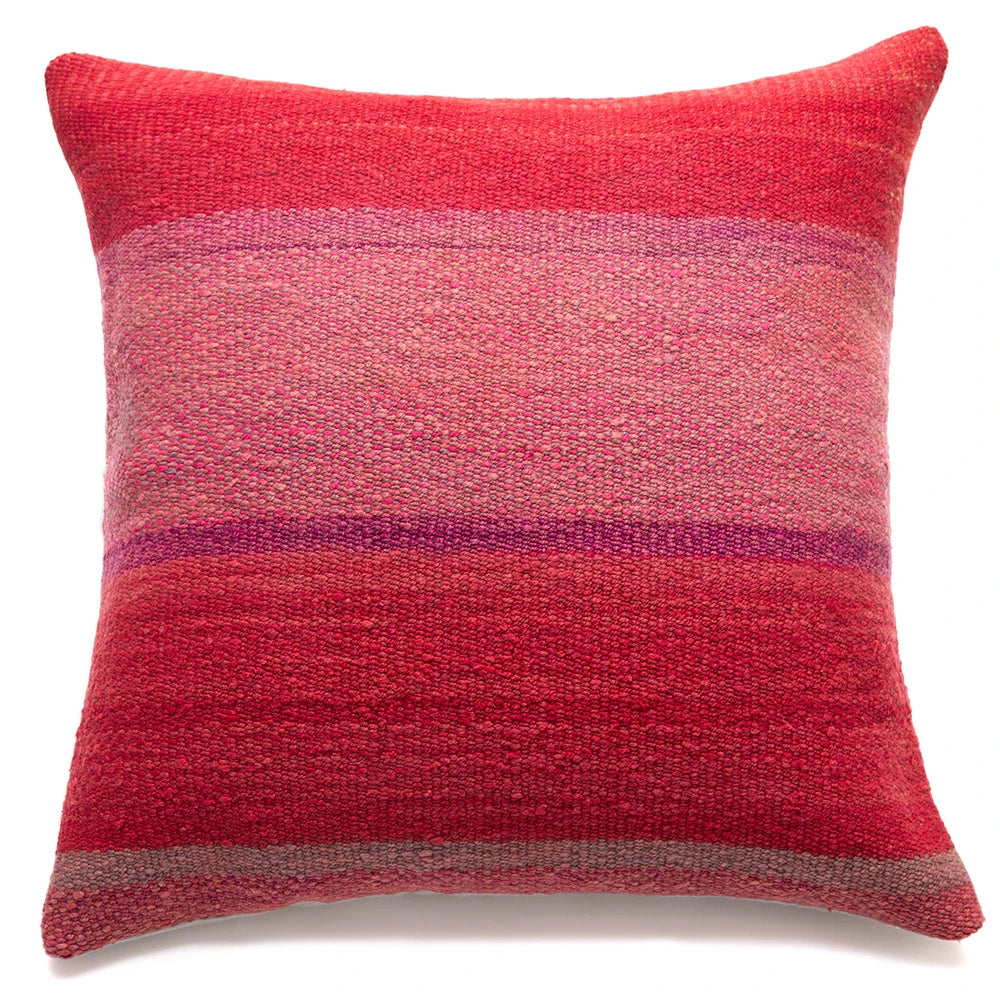 A square woven throw pillow in a textured red and pink striped pattern with a subtle purple accent band, shown against a plain white background.