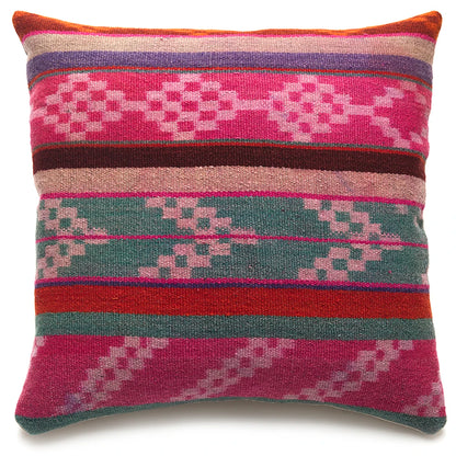 Multicolored patterned pillow with geometric design on a white background