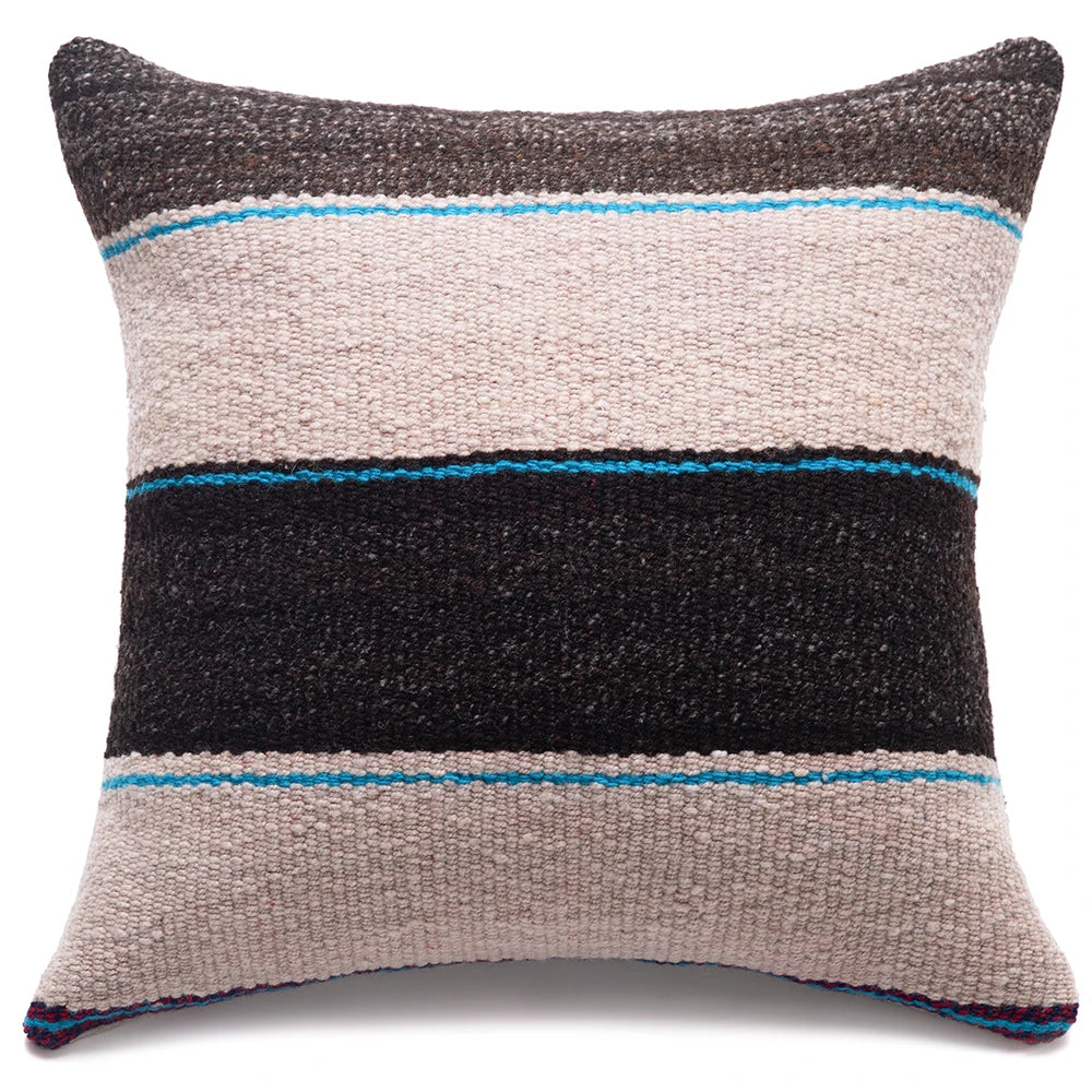 A square woven throw pillow with horizontal stripes in dark charcoal, light beige, black, and bright turquoise blue, shown against a plain white background.