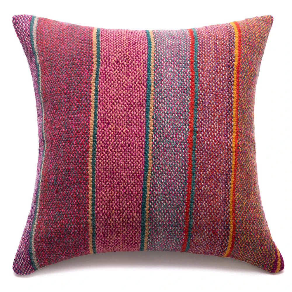 A square woven throw pillow featuring a textured multicolor pattern of vertical stripes in pink, red, orange, green, and blue on a white background.