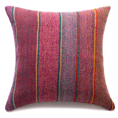 A square woven throw pillow featuring a textured multicolor pattern of vertical stripes in pink, red, orange, green, and blue on a white background.