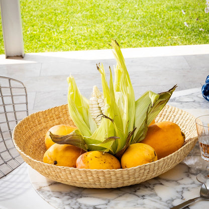 Intiearth El Sol Platter chica  bowl with corn and lemons on a marble table outdoors