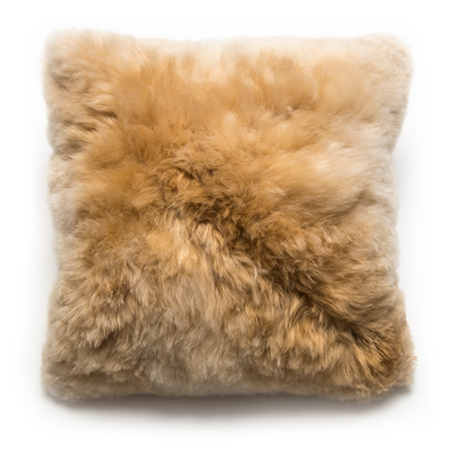 A square-shaped alpaca fur  pillow with a zipper closure, displaying a natural champagne color.