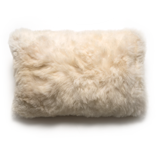 A beige, curly-fur alpaca lumbar pillow without an insert on white background
