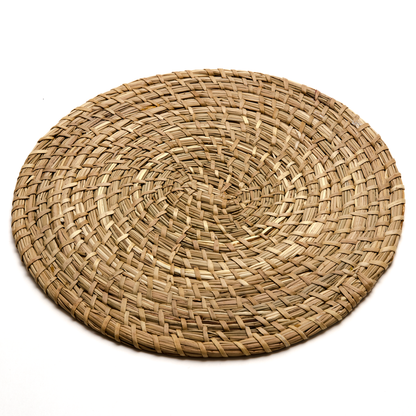 Intiearth natural fiber coiled placemat made from dried junco grass, offering a rustic yet elegant touch to your table setting.
